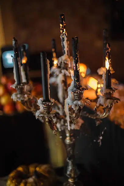 Photo of melting candles and pumpkins