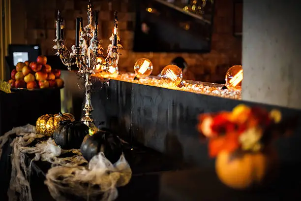 Photo of melting candles and pumpkins