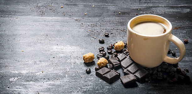 istock Cup of coffee with bitter chocolate and dark brown sugar. 609721552