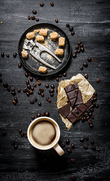 istock Cup of coffee with bitter chocolate and dark brown sugar. 609721744