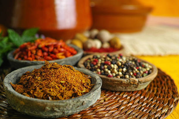 istock Red, hot chili, black, white peppers in old clay bowls 609722920