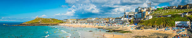istock Surfers sunbathers seaside ocean resort beach panorama St Ives Cornwall 609723134