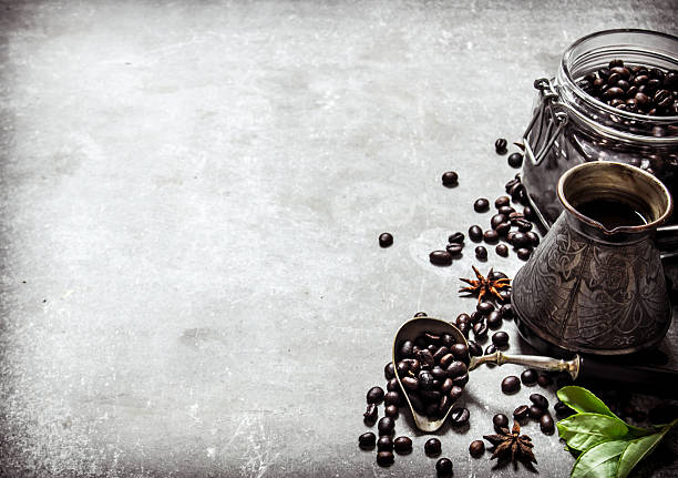 istock Coffee pot and grains in a glass jar. 609725390
