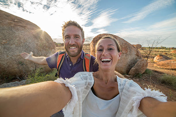 istock Selfie portrait of two young adults at the Devil's Marbles 609725512
