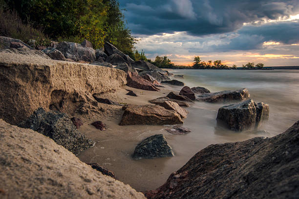 istock The coastline of sand and stones, evening light 609725578