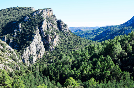 Amador rocks in Bejís province of Castellon, Spain, with stone walls and pine and oak forests in the valley of the river Palancia