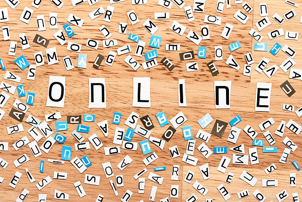 istock Online word from cut out letters 609728922