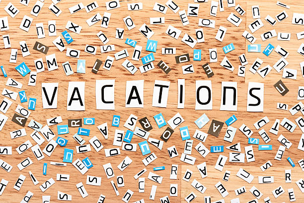istock vacations word from cut out letters 609790398