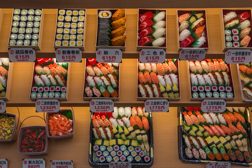 osaka, japan - June 1, 2016: Traditional sushi bentoboxes for sale in restaurant display at osaka japan