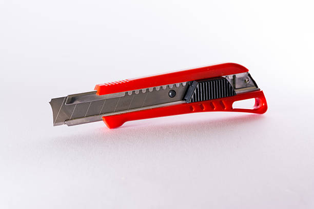 istock Bright Red Box Cutter Metal Blades New Clean Object White 609791574