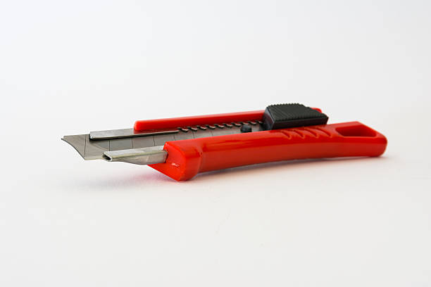 istock Bright Red Box Cutter Metal Blades New Clean Object White 609791616