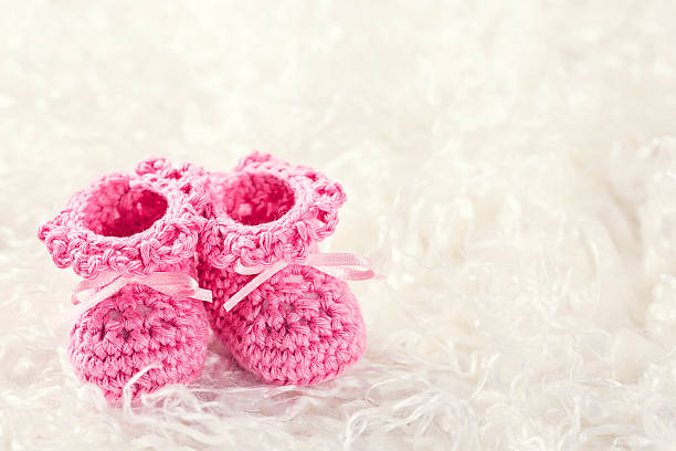 istock Pink baby crochet shoes 609793458