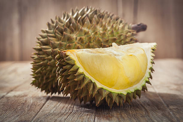 King of fruits Durian on wood background,King of fruits pics of a spiky fruit stock pictures, royalty-free photos & images