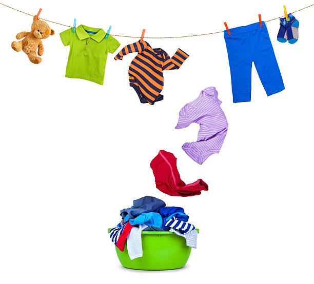 clothing falls from laundry line in wash bowl on white