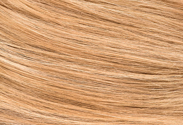istock Women's natural blonde hair background 609795418