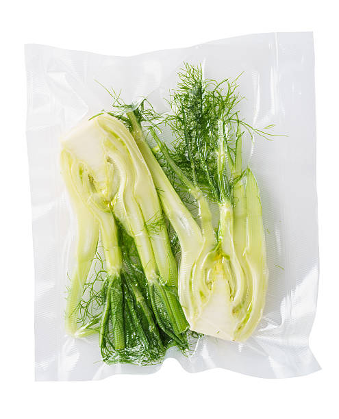 Vacuum sealed fennel Vacuum sealed fresh fennel for sous vide cooking cutout on white vacuum packed stock pictures, royalty-free photos & images