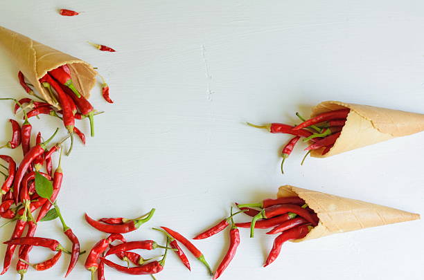 istock Red hot chili peppers in sugar waffle cones 609797894