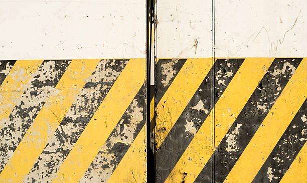 istock Yellow and black stripes on the concrete surface 609799066