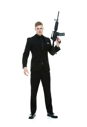 Angry businessman holding rifle