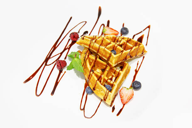 istock Viennese waffles drizzled with chocolate sauce  berries on a 609800146