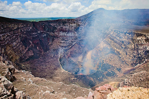 Masaya Volcano Volcan Masaya, or Masaya Volcano, on the outskirts of Managua. It has always been an active volcano, but recently the smoke has decreased and the visibility of lava has increased. masaya volcano stock pictures, royalty-free photos & images