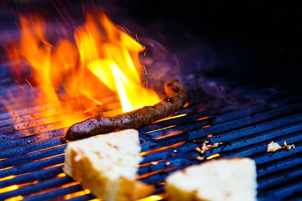 istock Sausages and bread fried on the grill 609805220