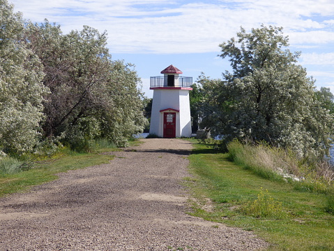 Lighthouse on a path near the lake