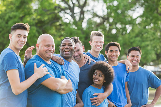 istock Multi-ethnic group of men and sons volunteering 609805994