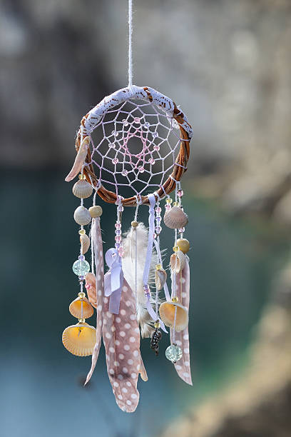 istock Handmade native american dream catcher on background of rocks an 609809214
