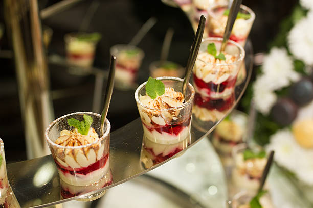 istock Sweet desserts with a leaf of mint on a table 609812452