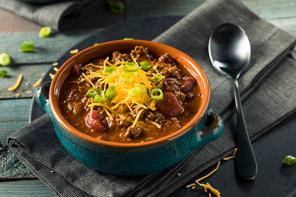 Homemade Beef Chili Con Carne Homemade Beef Chili Con Carne with Cheese and Onions chili con carne photos stock pictures, royalty-free photos & images