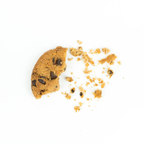 broken Chocolate chip cookie on white broken Chocolate chip cookie on white crumb photos stock pictures, royalty-free photos & images