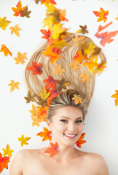 istock Beautiful woman with leaf 609813890