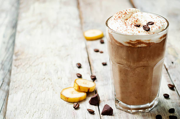 coffee chocolate banana smoothie with coconut whipped cream