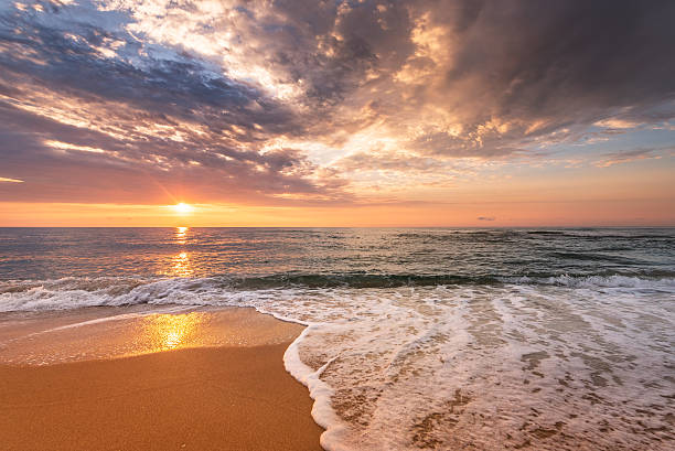 istock Brilliant ocean beach sunrise. 609821544