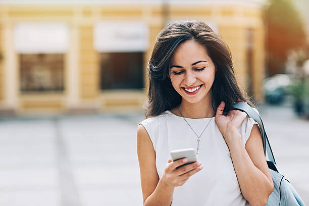 istock Girl texting on the street 609822518