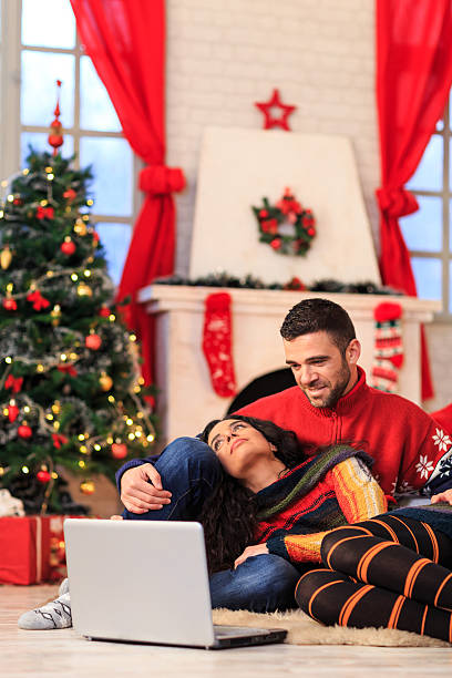 istock Young couple sitting on ground and resting at home 609824346