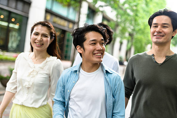 istock japanese friends walking in tokyo 609824376