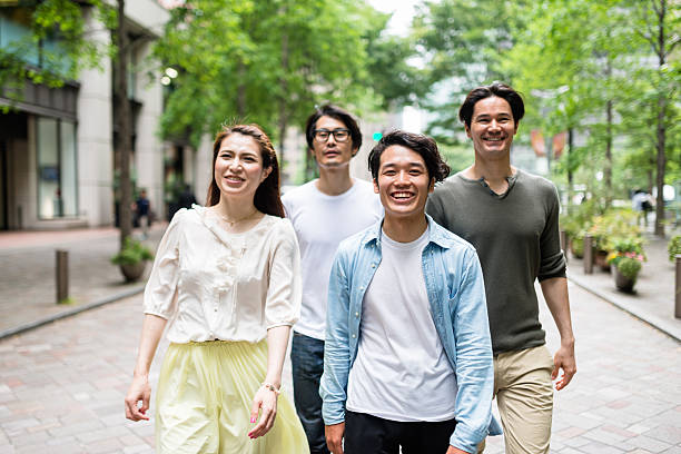 istock japanese friends walking in tokyo 609824420