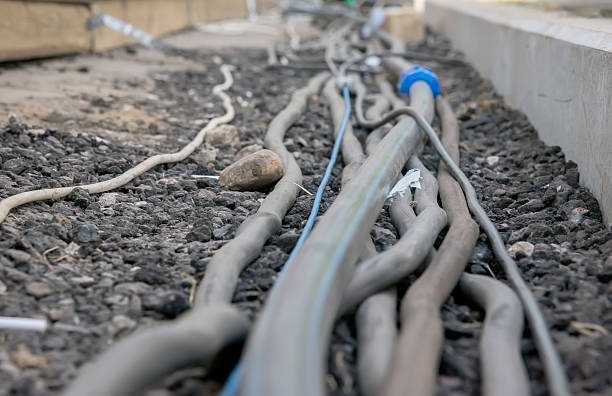 istock trail of power electrical cables on the ground 609824560