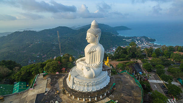 istock big Buddha in rainy season 609825106