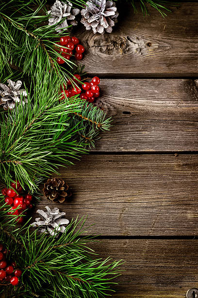 istock Xmas wreath card  with copyspace on wooden background. 609825526