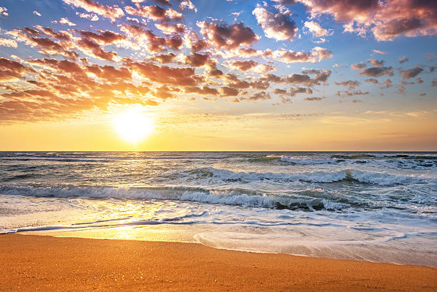 istock Colorful ocean beach sunrise. 609826210