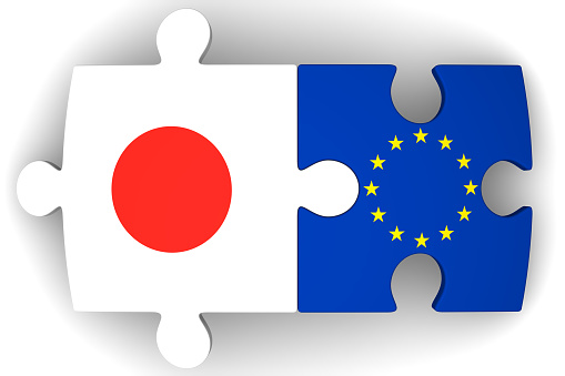 Puzzles with flags of the European Union and Japan on a white surface. The concept of coincidence of interests in geopolitics. Isolated. 3D Illustration