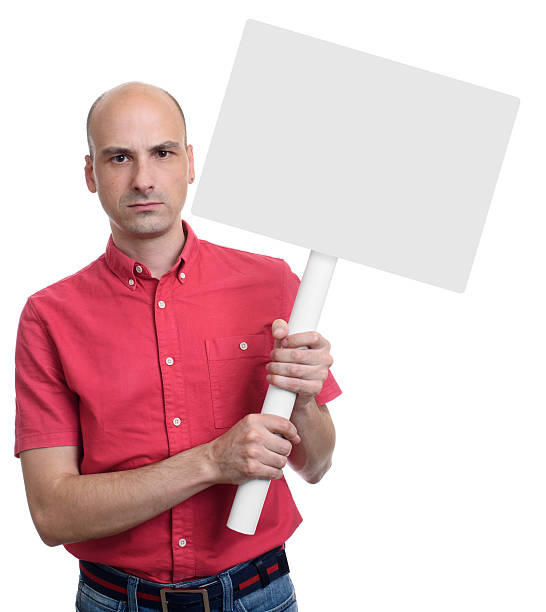 istock Protester man holding blank banner on stick 609827250