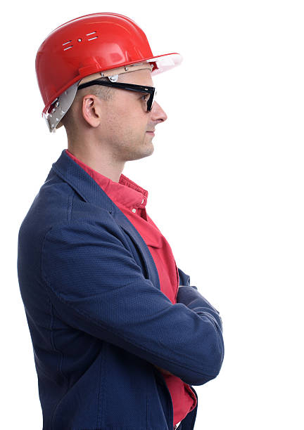 istock profile portrait of man wearing construction helmet 609827414