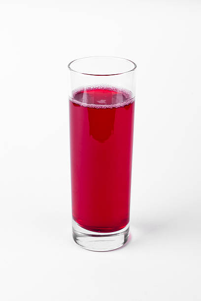 istock Red cranberry juice cocktail in glass on white background 609828682