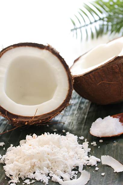 istock Still life of Grated fresh coconuts coconut oil and coconuts 609829336