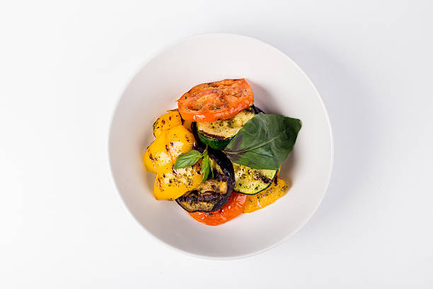 istock Grilled vegetables with tomatoes and eggplant in white plate 609830600