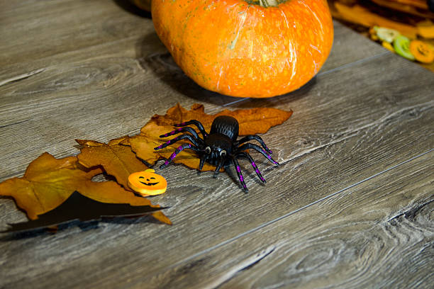 istock Halloween pumpkin head jack lantern on wooden background 609832174